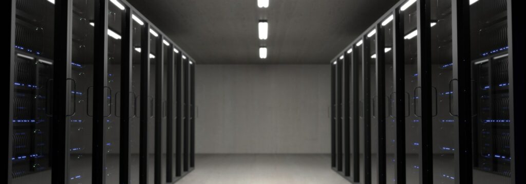 Room with large servers. Data centres which house servers run SaaS and other cloud services.