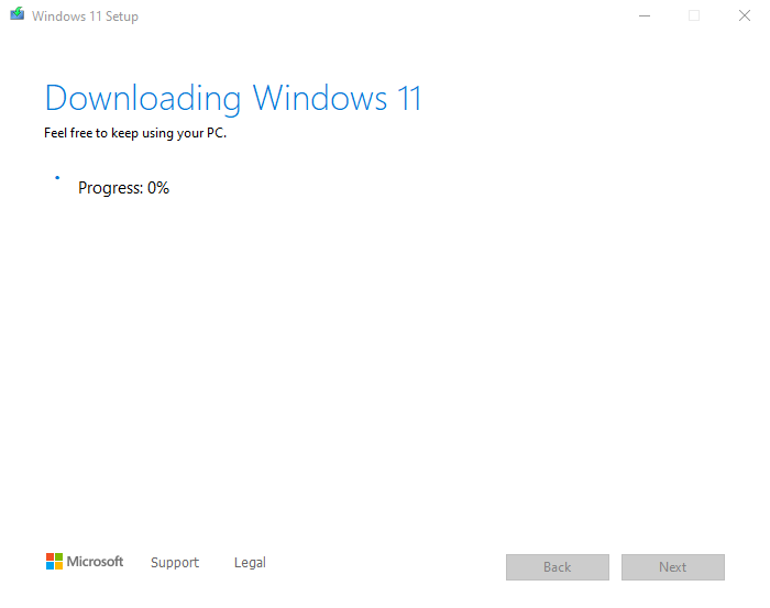 Wait for the Media Creation Tool to download Windows 11.